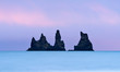 © Tandem Stock - Reynisdrangar sea stacks off the coast of Reynisfjara beach at Vik in Southern Iceland.
