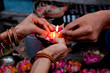 © Tandem Stock - Haridwar, India: Floating offerings are prepared and will be set onto the Ganges at nightfall.