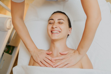 Wall Mural - upper chest massage of a woman laying down in spa