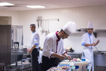 Wall Mural - team cooks and chefs preparing meals