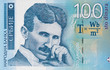 Serbia 100 dinars banknote. Nikola Tesla portrait. Serbian money currency close up.