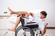 © Elnur - Young handsome man in wheelchair at the hospital