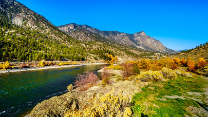 Fall colors surrounding the Thompson River at Goldpan Provincial Park on the Fraser Canyon route of the Trans Canada Highway, Highway 1, in British Columbia Canada
