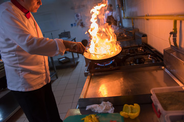 Wall Mural - Chef doing flambe on food