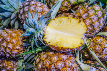 Wall Mural - Fresh ripe pineapples at fruit market,tropical fruit juice,diet fruit,vegetarian,high fiber