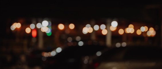 Wall Mural - abstract blurred cafe or restaurant in night time of urban with bokeh lights background.