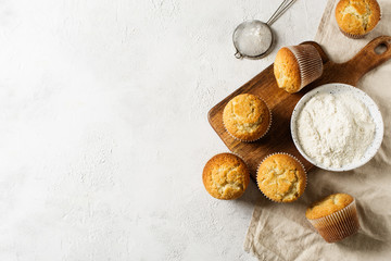 Homemade tasty miffins on white background