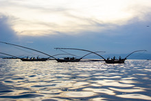 Fishing Canoes On Lake Kivu, Rwanda, With The Sun's Reflection On Water