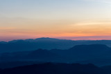 Fototapeta Góry - Sunrise view over mountains from a mountain peak. Mountains silhouette. Nature landscape.
