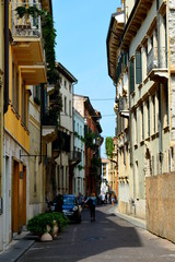 Wall Mural - Narrow street in old italian town