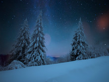 Fairy-tale Starry Night In The Ukrainian Carpathian Mountains With The Galaxy Milky Way In The Sky And The Glow Of The Full Moon Winter Frosty Time On The Background Of A Cozy Little House.