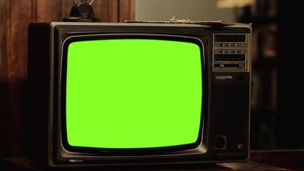 Wall Mural - 80s tv turning on green screen. close-up. zoom in. you can replace green screen with the footage or 