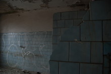 Detail Of Broken Shower In Bathroom In Scary Abandoned Building 