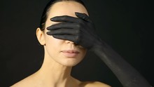Beautiful Woman Closes Her Eyes With Her Black Painted Hands. Close-up Of Palm Of The Hand From A Woman That Covers Her Face. Caucasian Woman Covering Her Face With Her Hands.