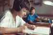 © sakkmesterke - Happy little schoolboys doing homework at home