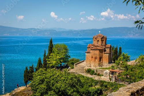 Fotografie, Obraz An orthodox church with the beautiful Ohrid lake in a blue sky day