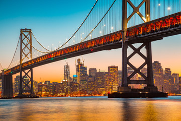 San Francisco skyline with Oakland Bay Bridge at sunset, California, USA