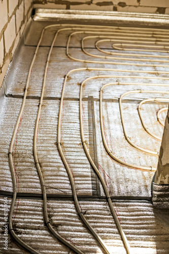 The Process Of Installation Of Heat Flooring In A New Building