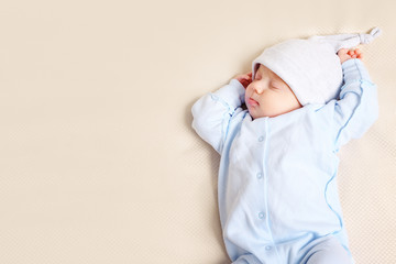 cute baby sleeping on bed