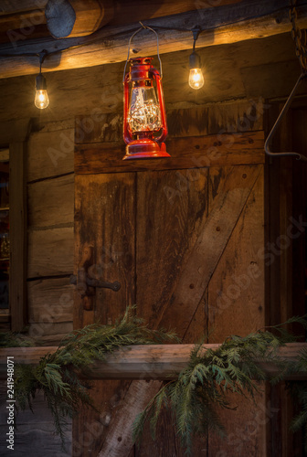 Red Metal Storm Lantern Hung Outside Rustic Log Cabin Buy This