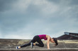 © torwaiphoto - Woman exercising outdoors she acted 'Mountain climber'