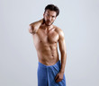 © oleg_ermak - Wet sexy torso handsome men in good shape wrapped in the blue towel and style haircut poses over grey background