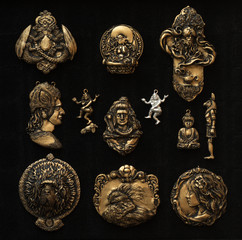 Set of metal sculpture miniature bas reliefs isolated on black