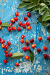© Olha Afanasieva - Fresh red cherry on wood boards