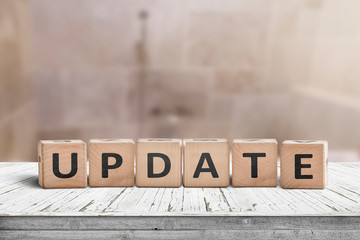update message sign on a wooden desk in a room