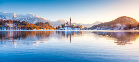 Fototapete - Lake Bled with Bled Island and Castle at sunrise in winter, Slovenia