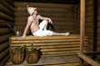 © dtatiana - Man in a wooden Russian bathhouse