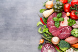 Fototapeta Kuchnia - Raw fresh meat Ribeye Steak with vegetables and spice.
