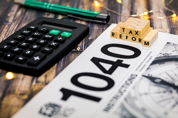 Tax Reform still life business finance concept with laptop, stock chart, shallow DOF