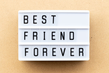 Poster - Light box with word best friend forever on wood background