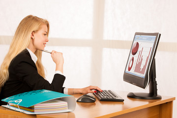 Sticker - Beautiful young blonde woman working on computer in her office