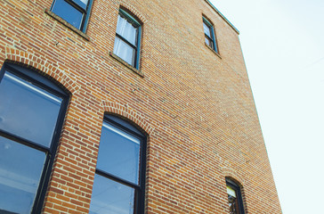 brick building on a cloudy day