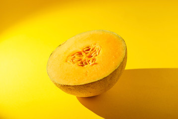 Wall Mural - Cantaloupe on yellow background