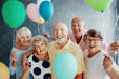 © Photographee.eu - Happy senior people with colorful balloons during friends party