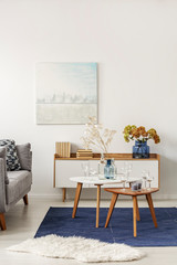 Wall Mural - Light blue and grey abstract painting on empty white wall of stylish living room