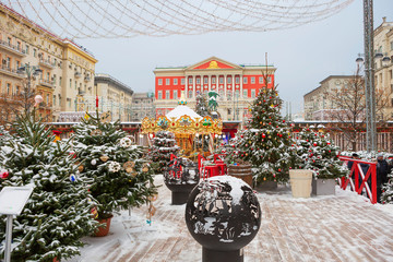 Wall Mural - Moscow, Russia, New Year at the city hall. Christmas trees, carousel, light garlands - all for the new year holiday.