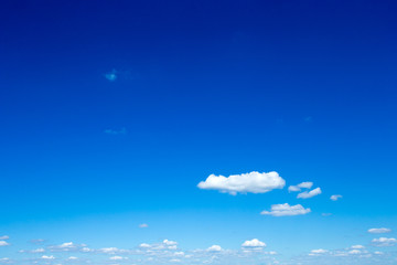 blue sky background with tiny clouds