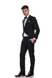 © Viorel Sima - classy man in black tuxedo standing with hands in pockets