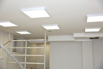 Suspended ceiling with modern LED lighting.