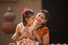 Portrait Of Loving Indian Mother And Daughter At Village