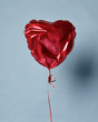 Party is over deflated red heart balloon object for birthday party or love valentines day