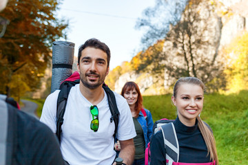 Wall Mural - group of hikers exploring places, trekking in the nature