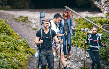 Group of hikers exploring mountain, trekking in nature