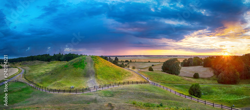Fotomural Sunset over Royal Mounds in Gamla Uppsala, Uppland, Sweden (HDR pnorama)