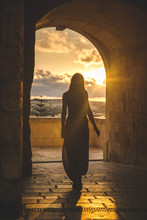 Girl Walking In A Medieval Castle