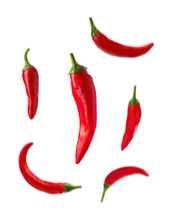 Set With Fresh Red Chili Peppers Falling Against White Background